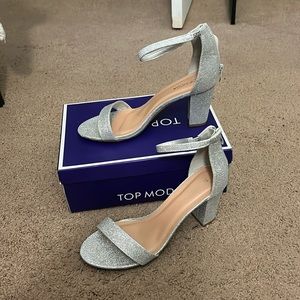Very pretty sliver heels with a zipper in the back